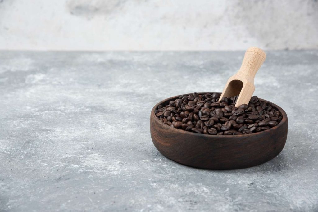 wooden-bowl-medium-roasted-coffee-with-spoon-marble-surface (1)